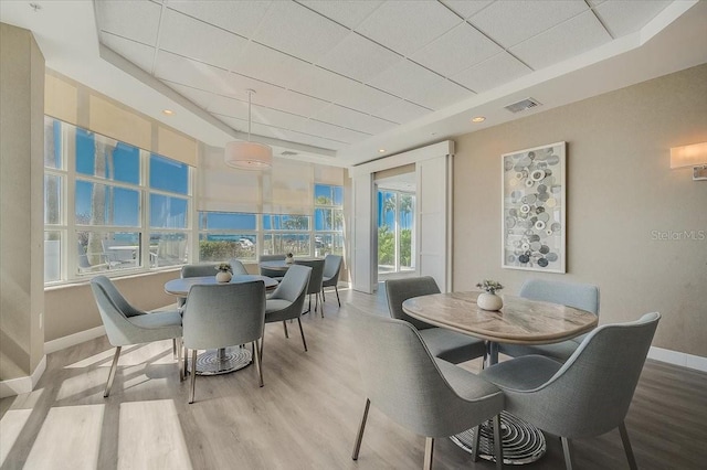 dining room with plenty of natural light and hardwood / wood-style flooring