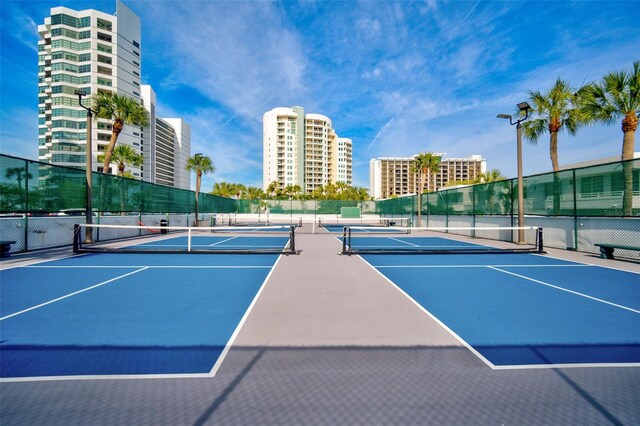 view of tennis court featuring basketball court