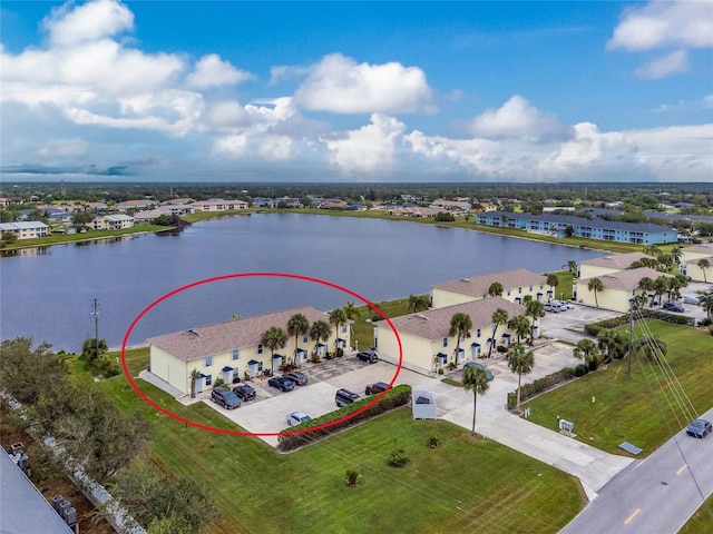 birds eye view of property with a water view