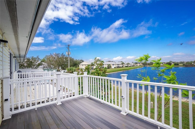 wooden deck with a water view