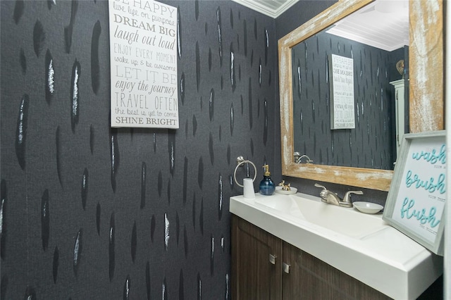 bathroom with crown molding and vanity