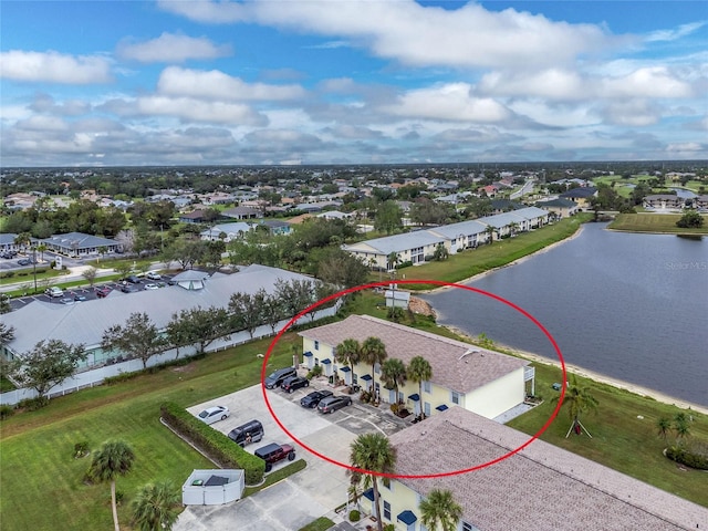 birds eye view of property with a water view