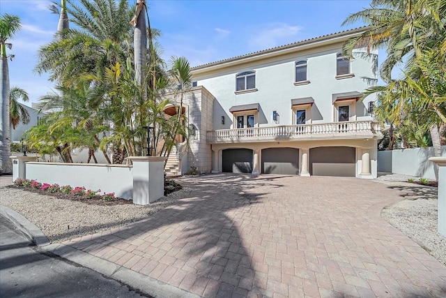 mediterranean / spanish-style home with a garage