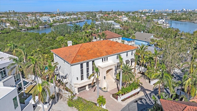 birds eye view of property with a water view