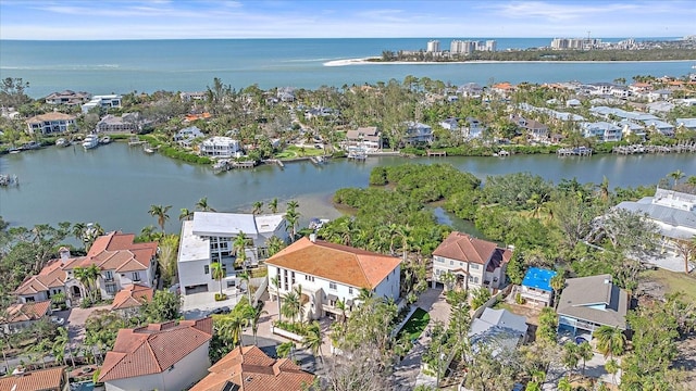 birds eye view of property featuring a water view