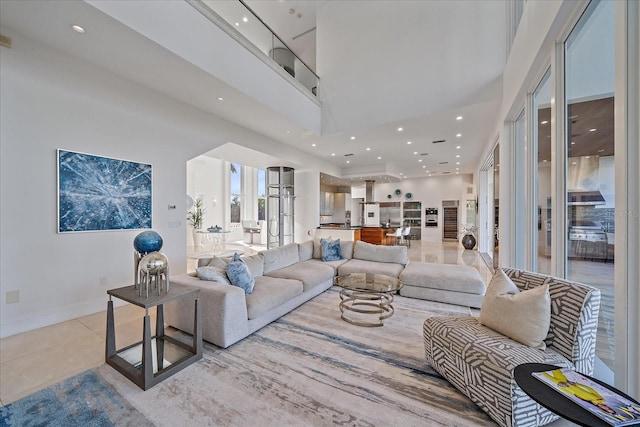 living room featuring a towering ceiling