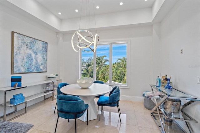 dining space with light tile patterned flooring and a notable chandelier