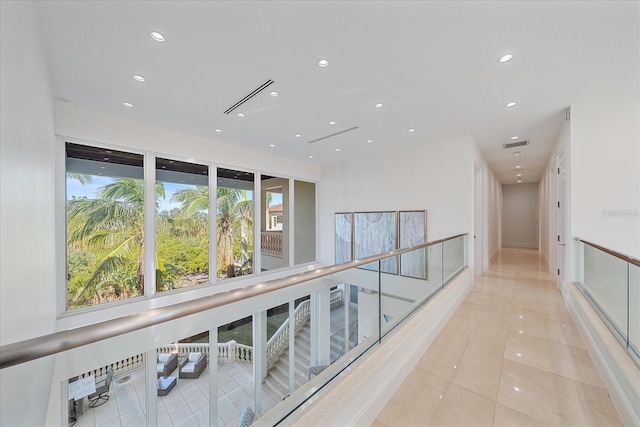 hall with light tile patterned flooring