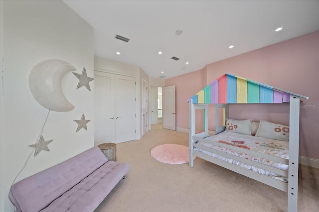 carpeted bedroom featuring a closet