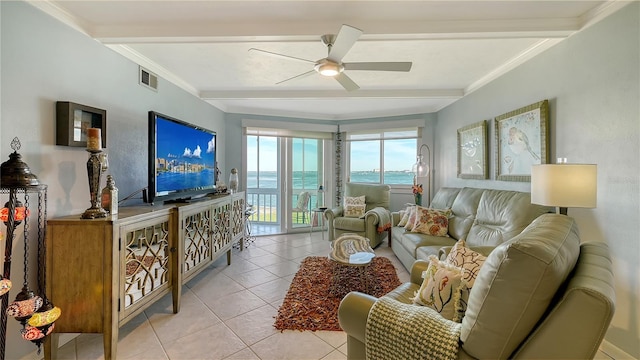 tiled living room featuring ceiling fan, beam ceiling, and crown molding