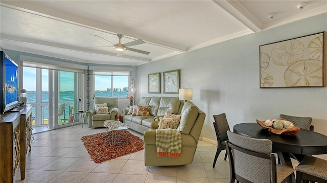 living room with beam ceiling, ceiling fan, light tile patterned flooring, and ornamental molding