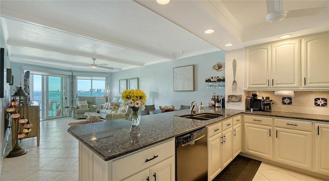 kitchen featuring kitchen peninsula, black dishwasher, dark stone counters, and sink