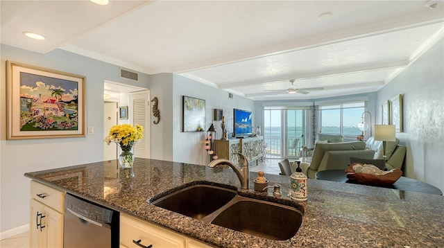 kitchen featuring dark stone countertops, ceiling fan, dishwasher, and sink