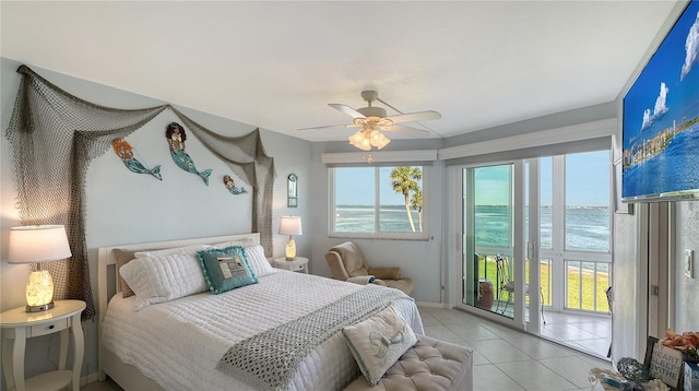 tiled bedroom with ceiling fan and access to exterior