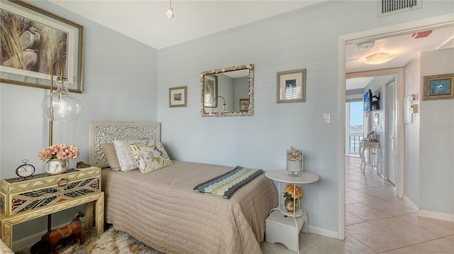 bedroom featuring light tile patterned floors