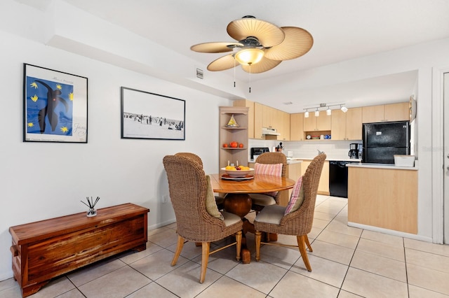 tiled dining area with ceiling fan