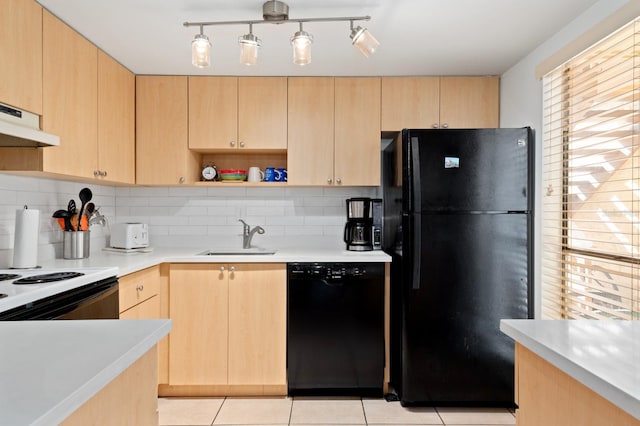 kitchen with decorative backsplash, light brown cabinets, sink, and black appliances