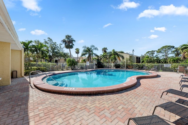 view of swimming pool with a patio area