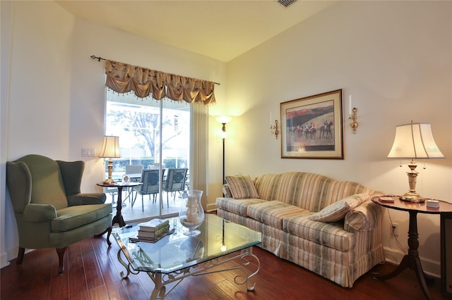 living room featuring dark wood-type flooring