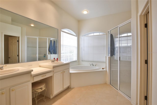 bathroom with plus walk in shower, tile patterned floors, and vanity