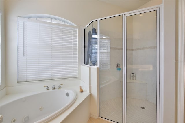 bathroom with separate shower and tub