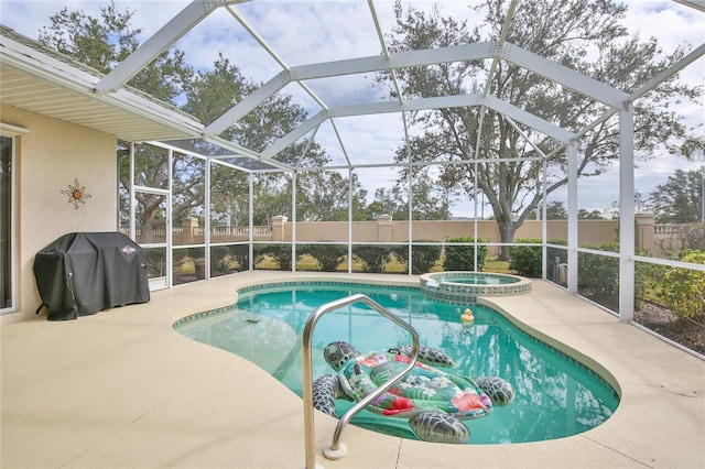 view of swimming pool with an in ground hot tub, grilling area, a lanai, and a patio area