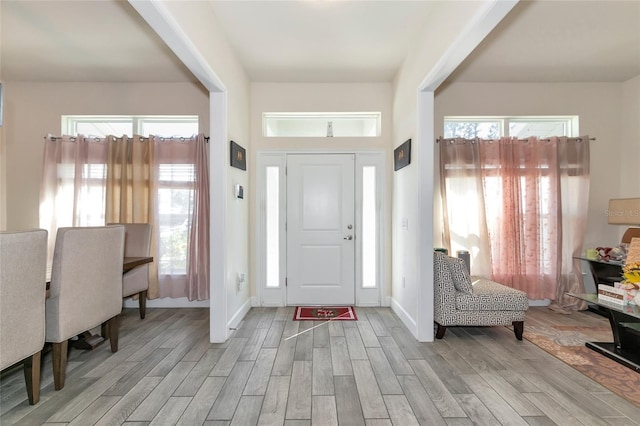 entryway with light hardwood / wood-style floors