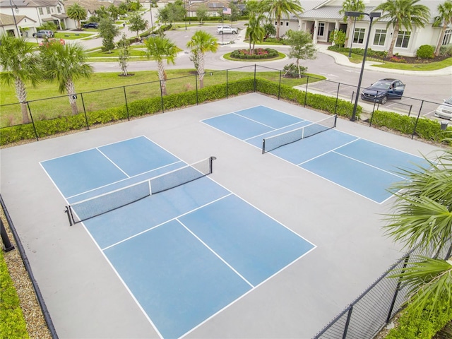 view of sport court with basketball hoop