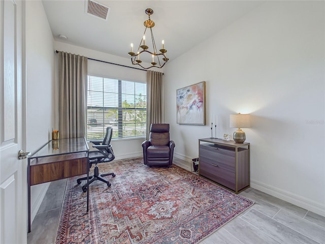 office space with an inviting chandelier