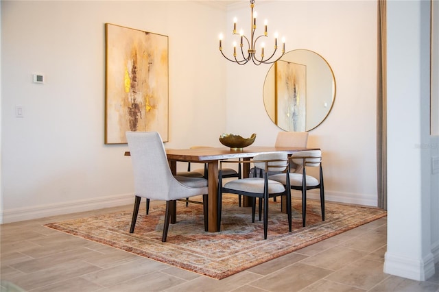 dining area featuring a chandelier and light hardwood / wood-style floors