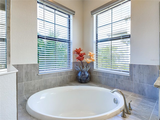 bathroom featuring a relaxing tiled tub