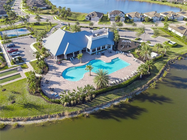 birds eye view of property with a water view