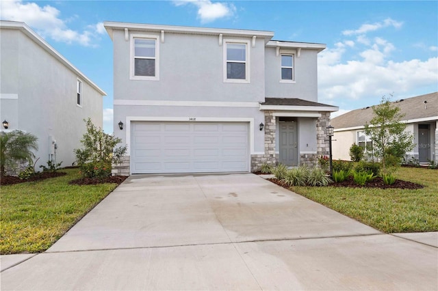 view of front of property with a garage and a front yard