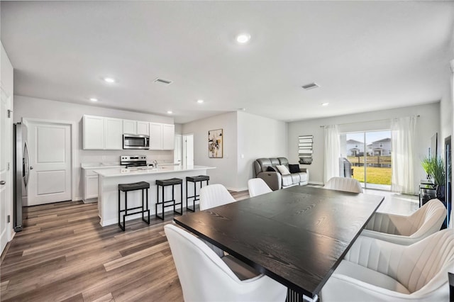 dining room featuring dark hardwood / wood-style flooring