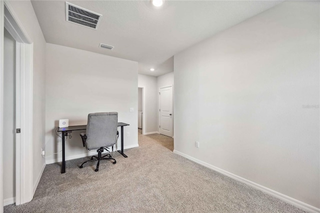 office area featuring light colored carpet