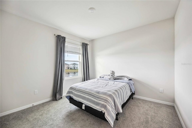 bedroom with light carpet