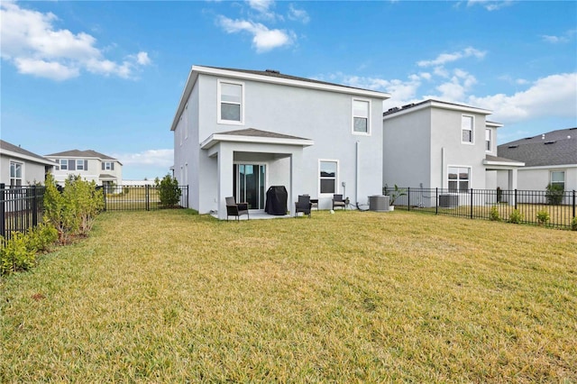 rear view of house with a patio area, a lawn, and central air condition unit