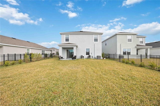 rear view of property featuring central AC unit and a lawn