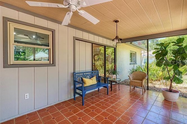 exterior space with ceiling fan and wooden ceiling