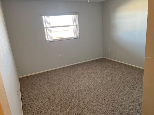 unfurnished room featuring carpet floors