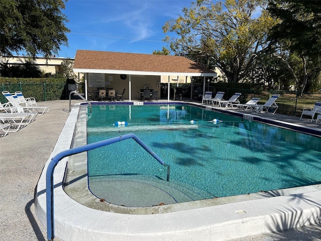 view of swimming pool with a patio area