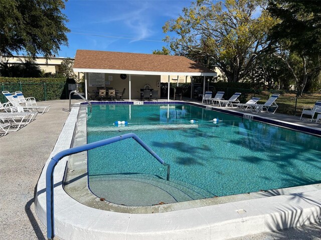 view of swimming pool featuring a patio area