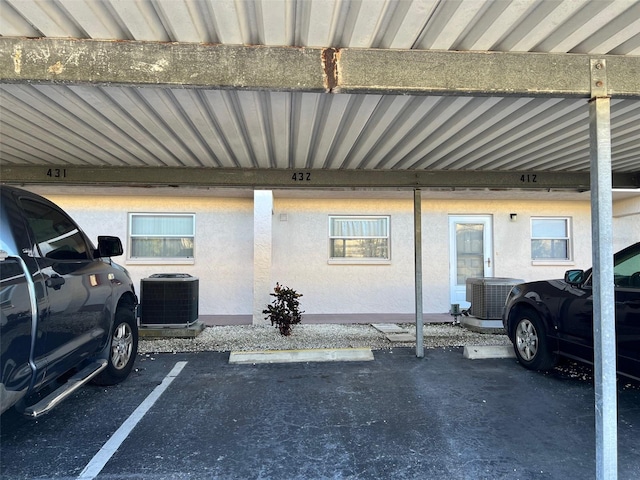 view of parking / parking lot with a carport