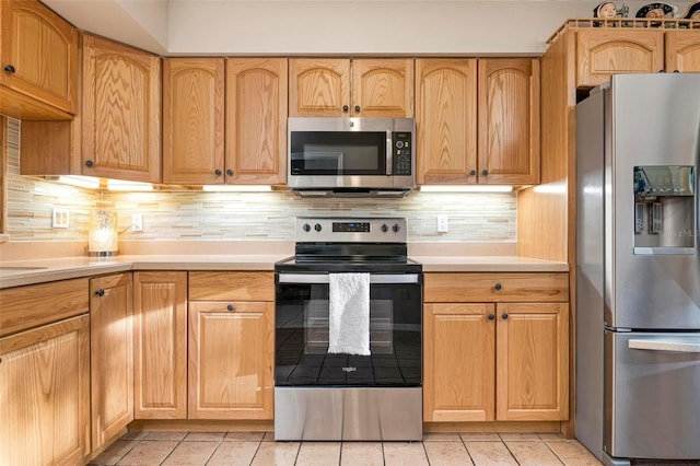 kitchen featuring decorative backsplash and stainless steel appliances