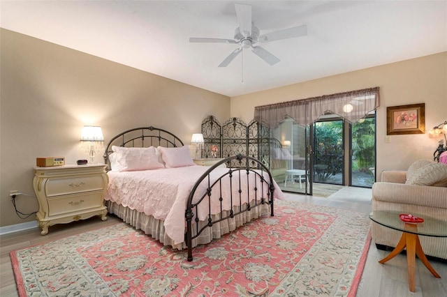 bedroom featuring ceiling fan, access to exterior, and light hardwood / wood-style flooring