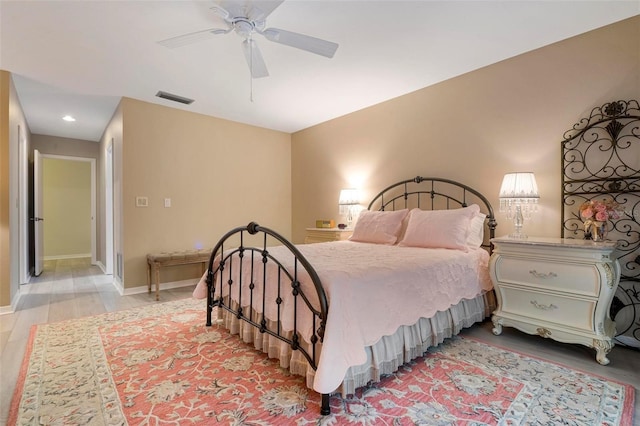 bedroom featuring light hardwood / wood-style floors and ceiling fan