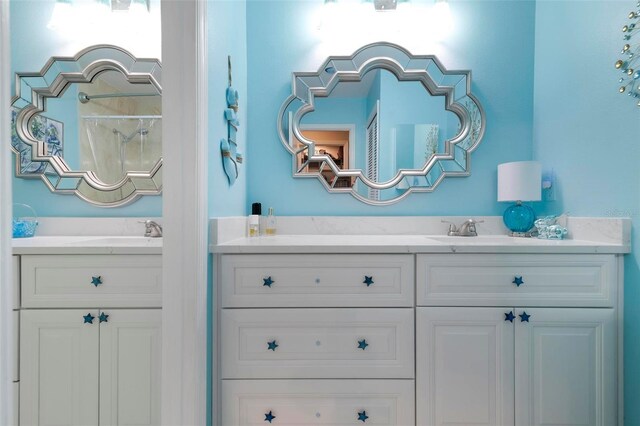 bathroom with vanity and walk in shower