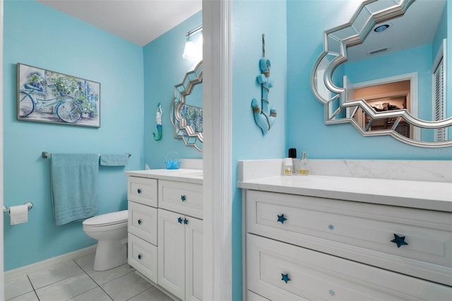 bathroom with tile patterned floors, vanity, and toilet