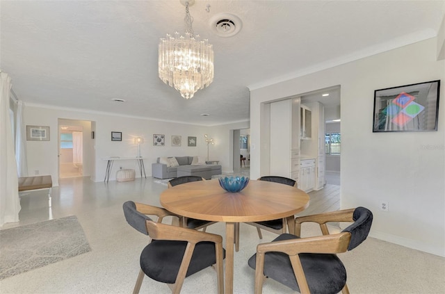 dining area with a notable chandelier