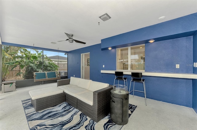 view of patio featuring an outdoor living space and ceiling fan